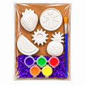 Fruit-themed plaster painting kit with strawberry, orange slice, watermelon, pineapple, and sun shapes, five paint colors, and a paintbrush.