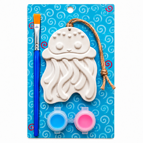 A children's plaster paint kit on a blue patterned backing card, featuring a white jellyfish plaster with a hanging string, a blue paintbrush with an orange bristle cap, and two small paint pots in blue and pink.
