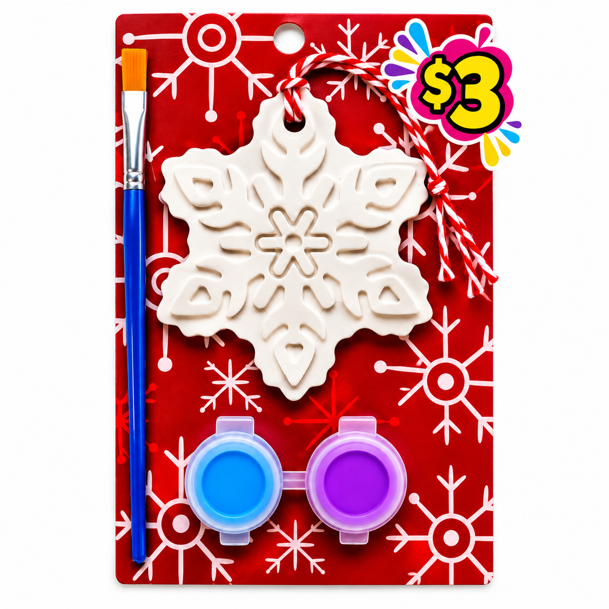 Plaster snowflake ornament paint kit with blue and purple paints and a paintbrush on a red snowflake card.